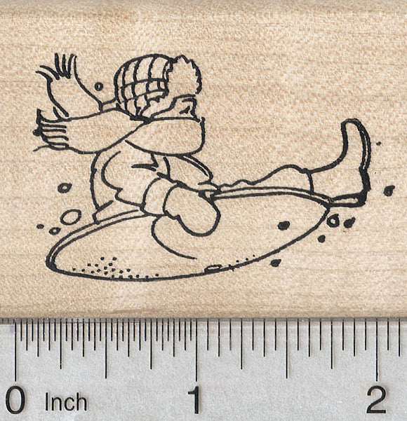Sledding Child Rubber Stamp, on Snow saucer
